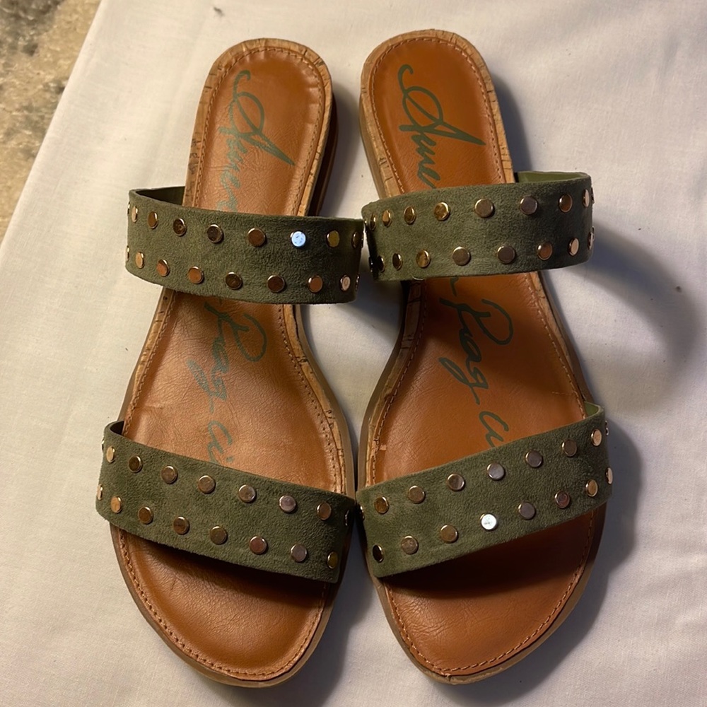 American Riag cie olive-colored slide sandals with brass rivet decorations